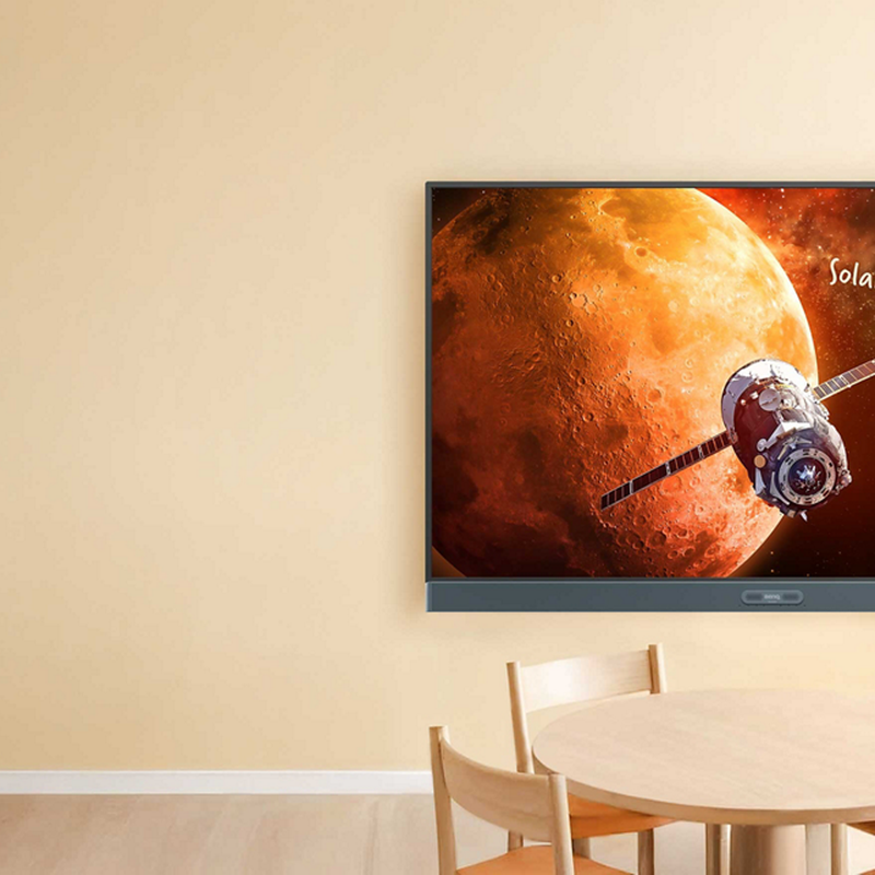 BenQ Board Pro 4K Interactive Display mounted on the wall of a modern classroom.