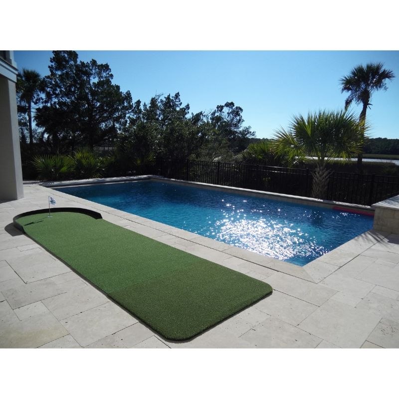 Big Moss Golf Commander Patio Series Putting & Chipping Green in 15x4 foot option shown outdoors by a pool.