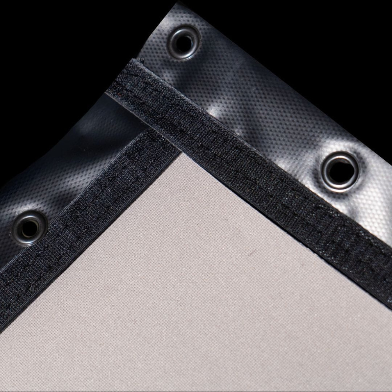 SIGPRO Premier Golf Simulator Impact Screen in an angled view of the corner with stitched black border and multiple grommets.