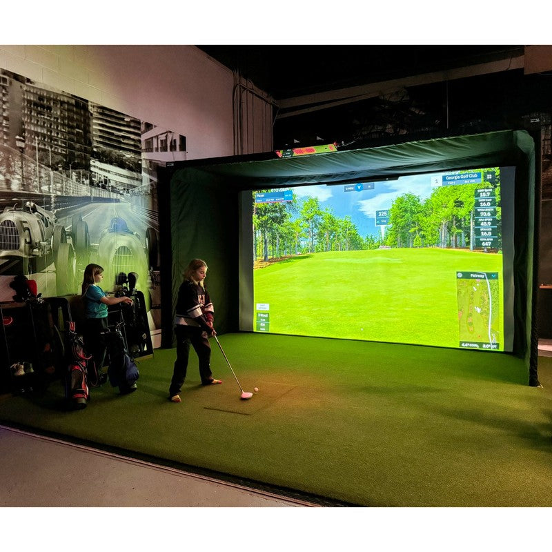 The SportsScreen Parlour Series Golf Simulator Enclosure custom golf studio with kids playing a round.